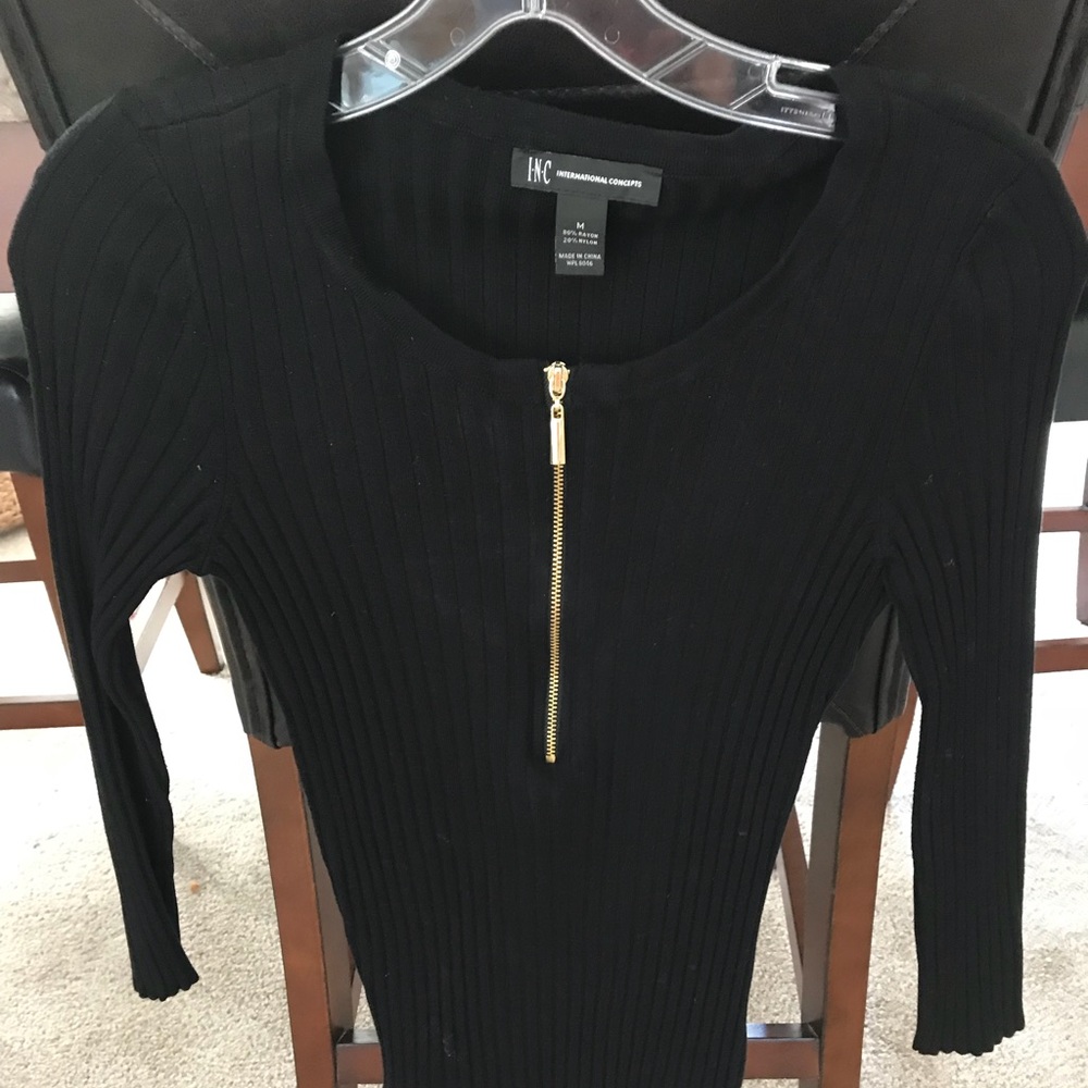 Black ribbed form fitting top with zipper front